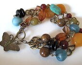 Butterfly charm and bead bracelet