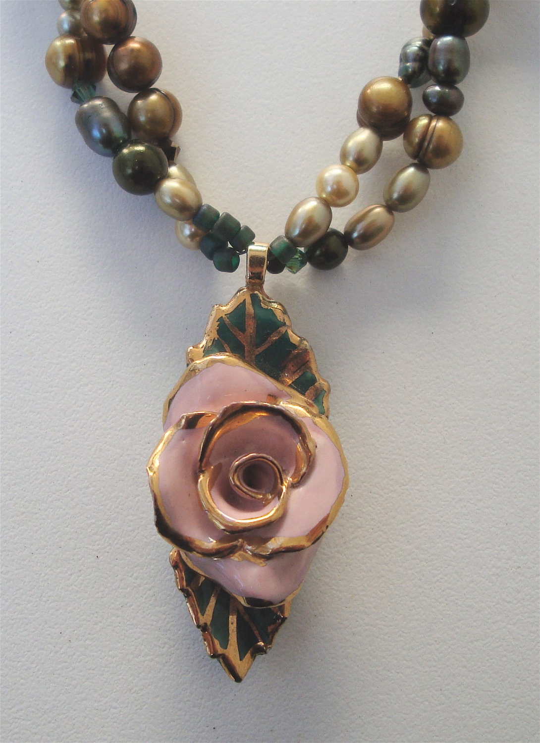 Vintage Avon ceramic brooch converted to a pendant for this dyed fresh water pearl necklace with tiny swarovski crystals.