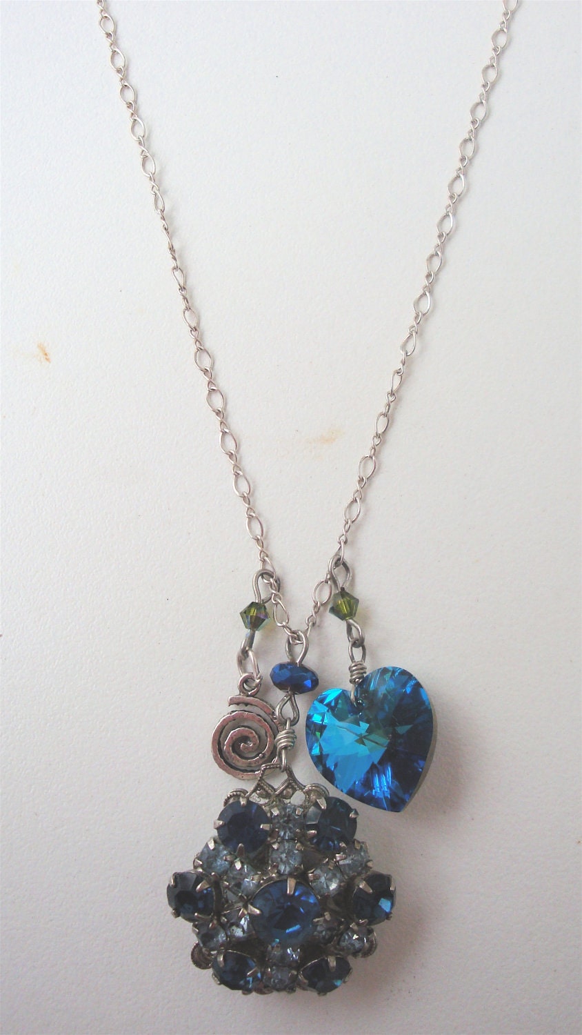 Vintage charm necklace featuring a beautiful, "recycled" 1950's clip-on earring as the focal poin