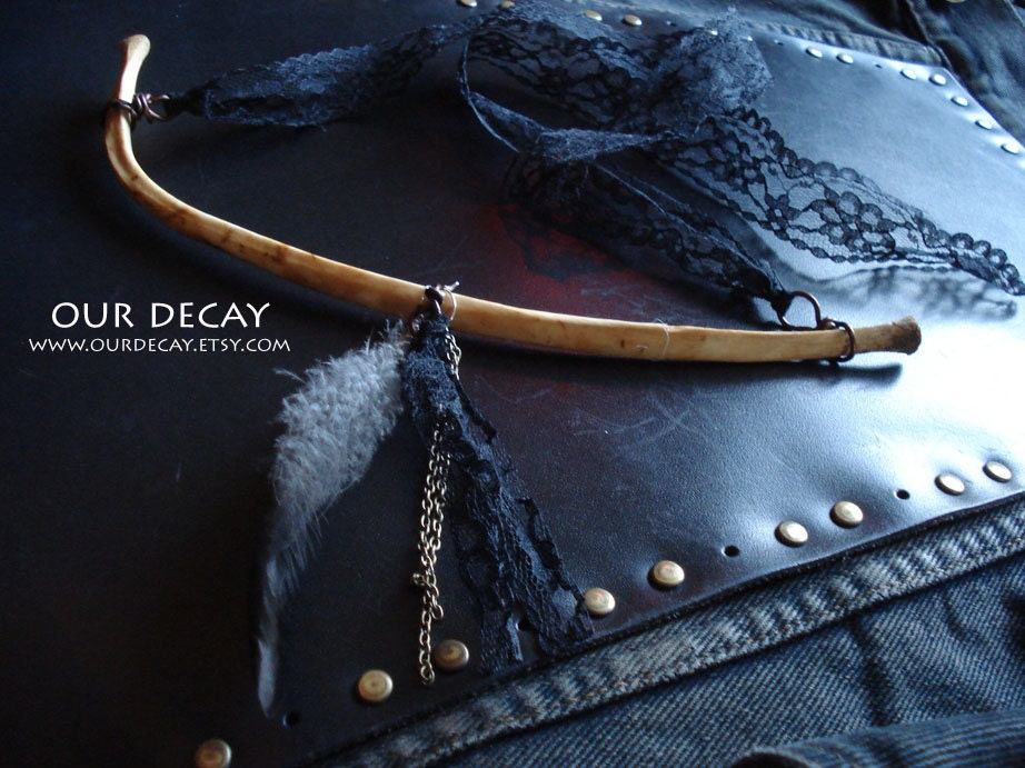 Nephthys - deer rib adorned with ribbons charms and feathers