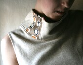 Cream sleeveless vest with cowl in herringbone weave