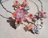 Sugar and Spice Cubic Zirconia and Lucite Floral Red and Peach Torque Necklace