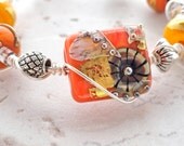 Debbie Sanders Signature Persimmon Coral Orange and Yellow Lamp work Bead  Wire Wrapped Bracelet