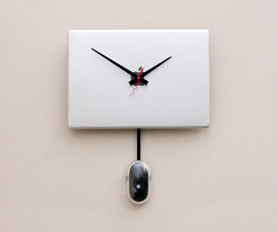 Clock created from a recycled Apple Powerbook laptop cover