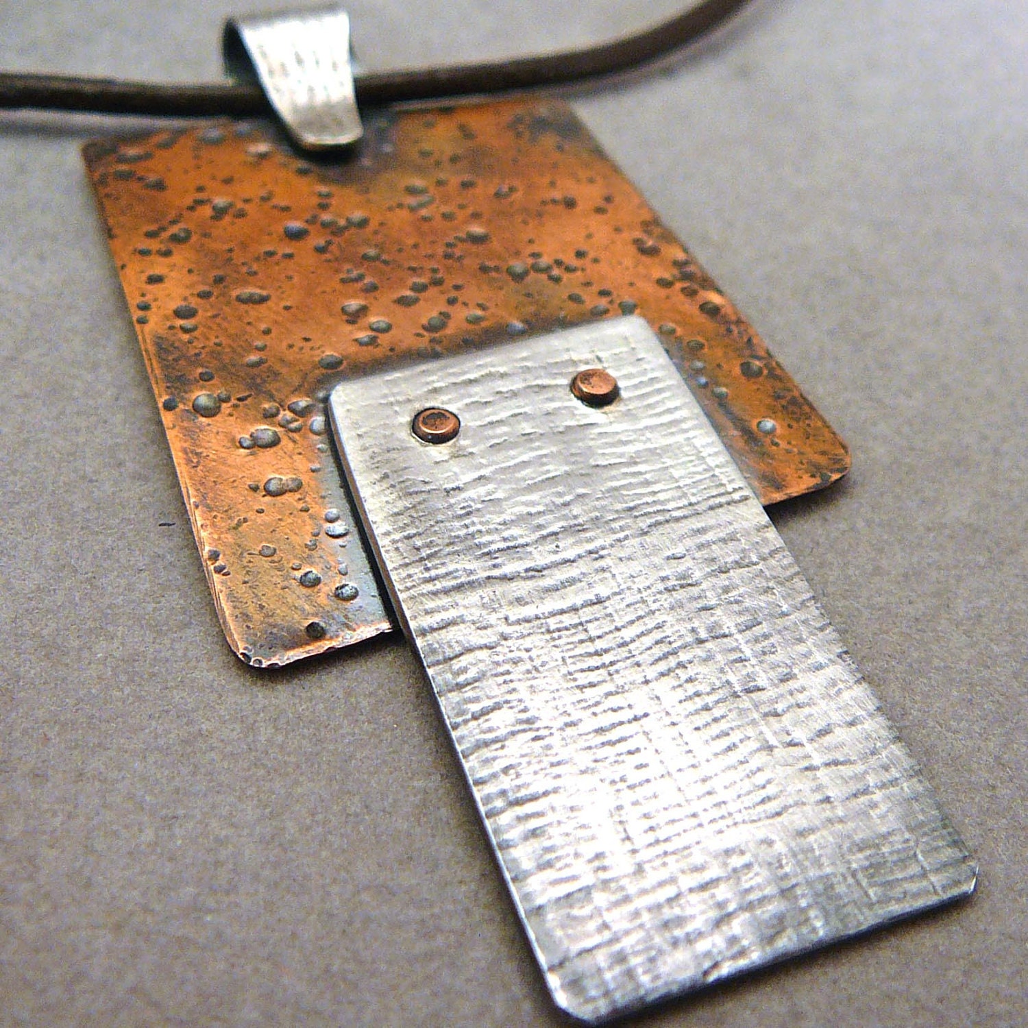 Textured sterling silver and copper riveted necklace