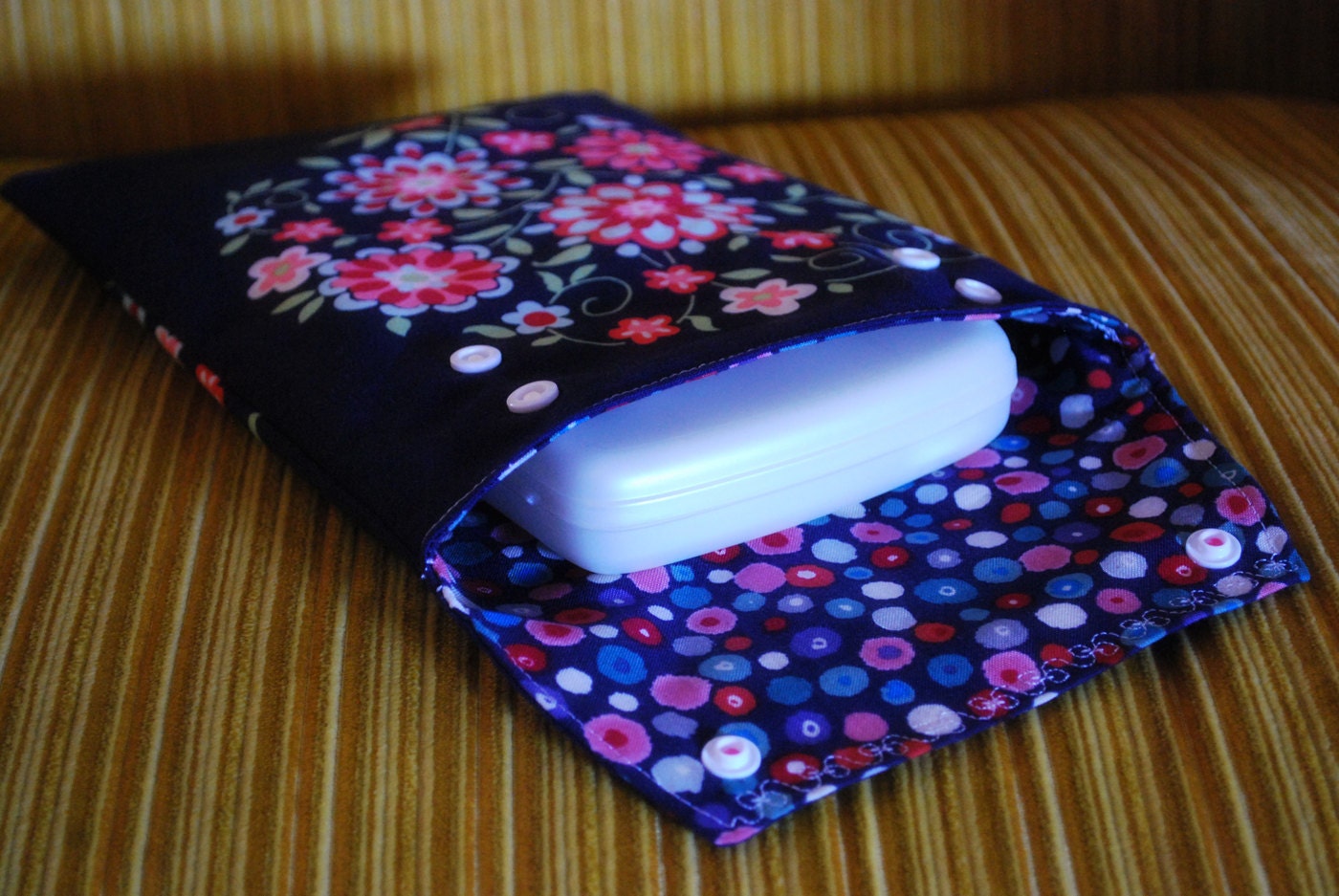 Diaper and wipes pouch with snap closures