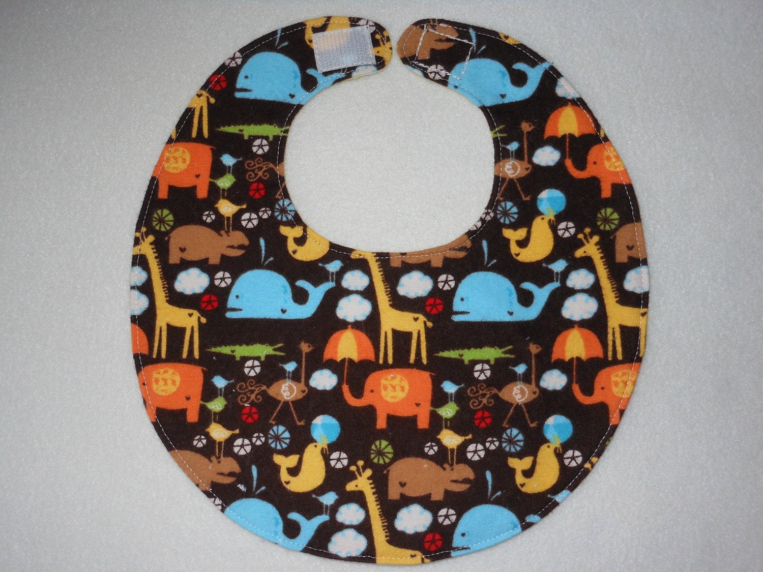 Baby Bibs, four soft layers, reversible, brown with bright critters