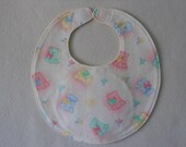 Baby bib, four soft layers, reversible, white with green, yellow, and blue teddys
