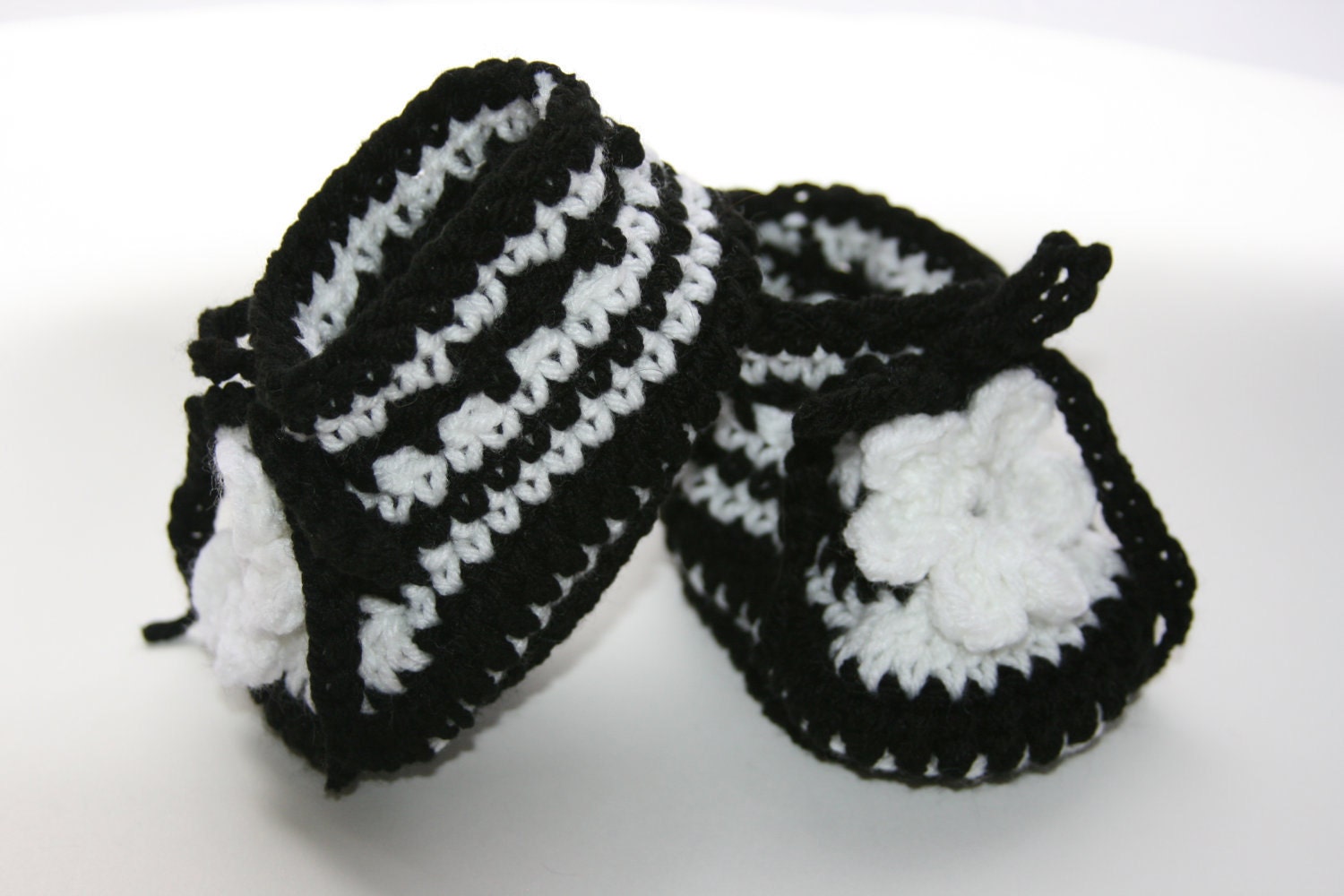 Baby booties Black and white striped with flower accent and ties. 0-3 month Custom available.