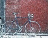 blue bicycle red wall