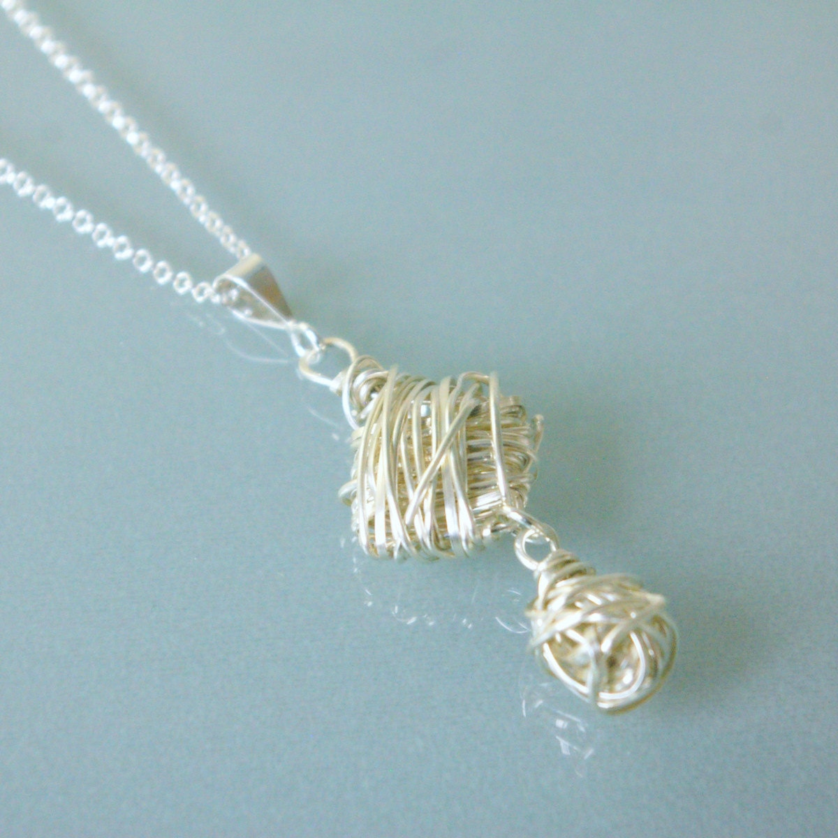 Silver cube woven pendant
