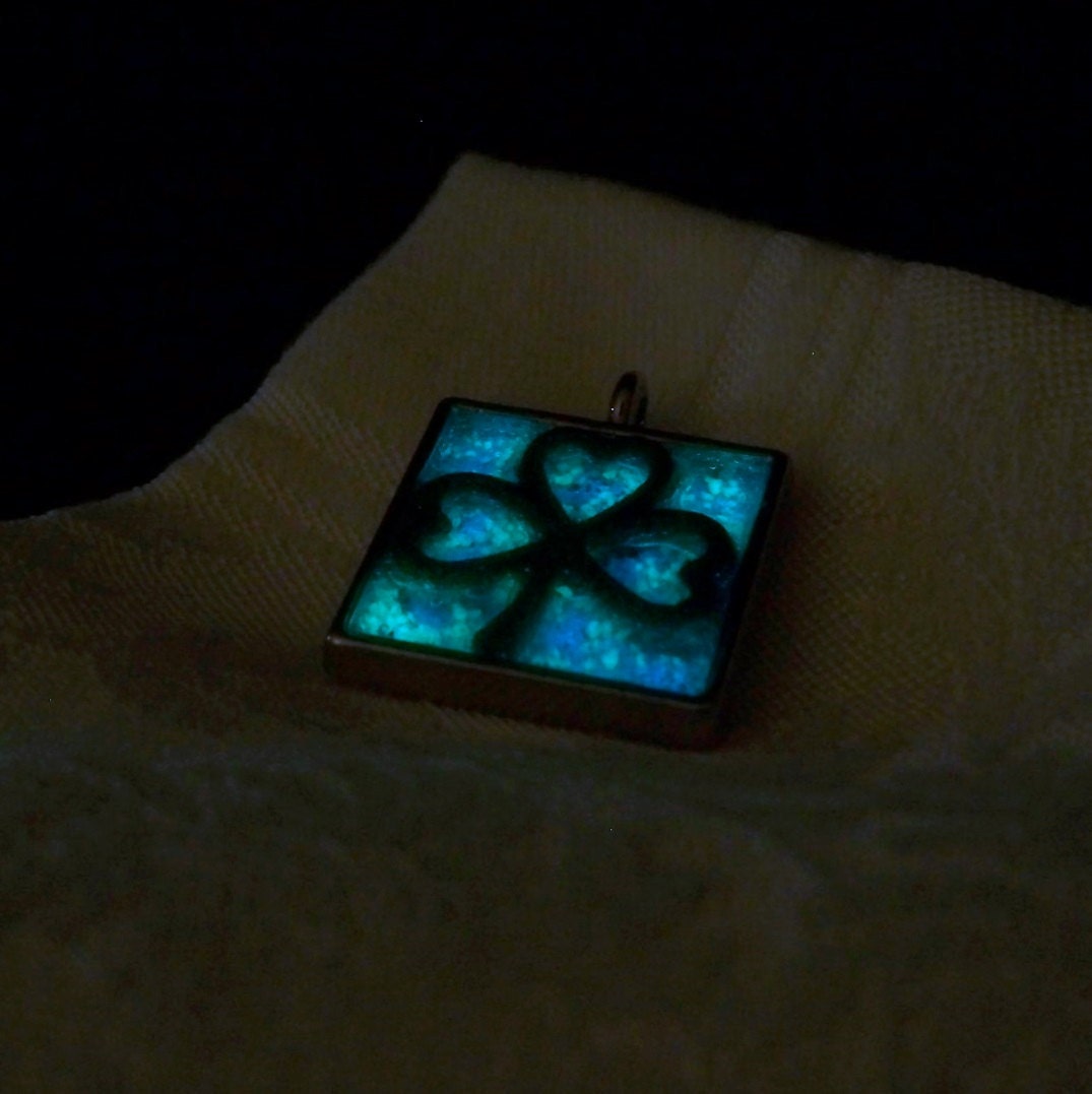 Magical Shamrock - Glow in the Dark Pendant - 4 Leaf Clover with Multi Colored Glowing Background - Charges in the Sun