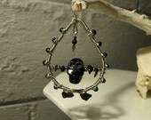 Black rock carved skull ear weights with black glass and sheen obsidian
