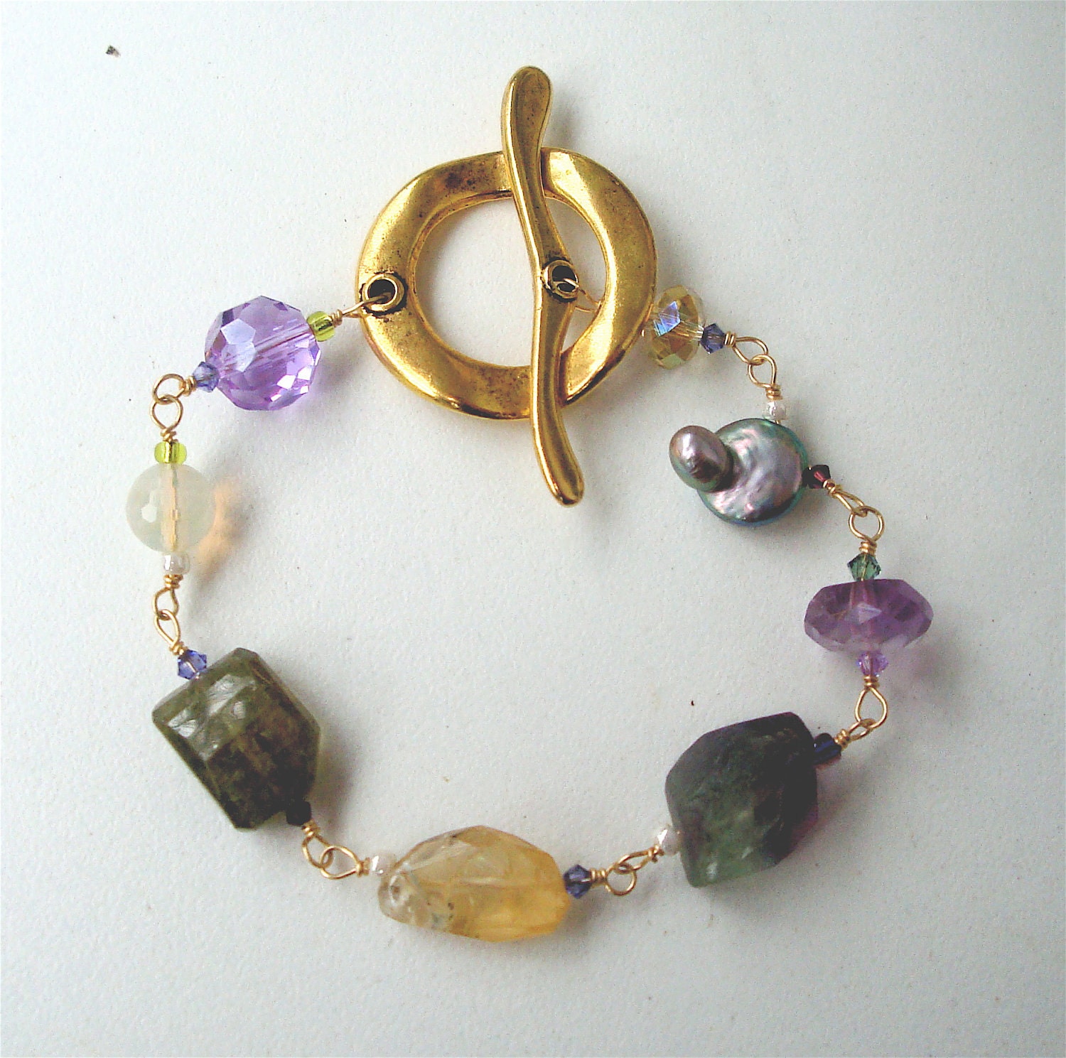Beautiful and feminine natural gemstone bracelet consisting of Pineapple Quartz,  white and dyed Fresh Water Pearls, Moss Agate, Jade and Sw