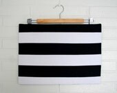 Oversized Black and white striped zippered clutch.