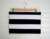 Black and white striped zippered clutch.