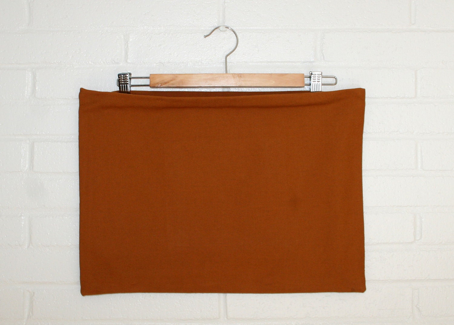 Oversized tan canvas zipper clutch purse.