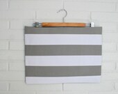Oversized Grey and white striped zippered clutch.
