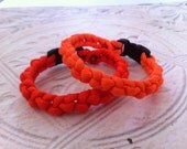 Orange & Tangerine Paracord Bracelets, Set of 2 Handwoven Bracelets with Black Buckle, Handmade Survival Jewelry by RuleNo15 on Etsy.