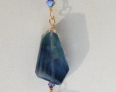 Long wire wrapped necklace with the pendant hanging 4 "long from a pretty gold dipped chain. Necklace is made from green Flourite, beautifu
