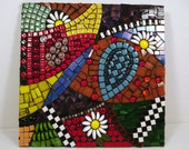 Spring garden glass and ceramic mosaic in bright rainbow colors with black and white accents, 12x12, framed
