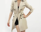 Beige trench coat with black leather
