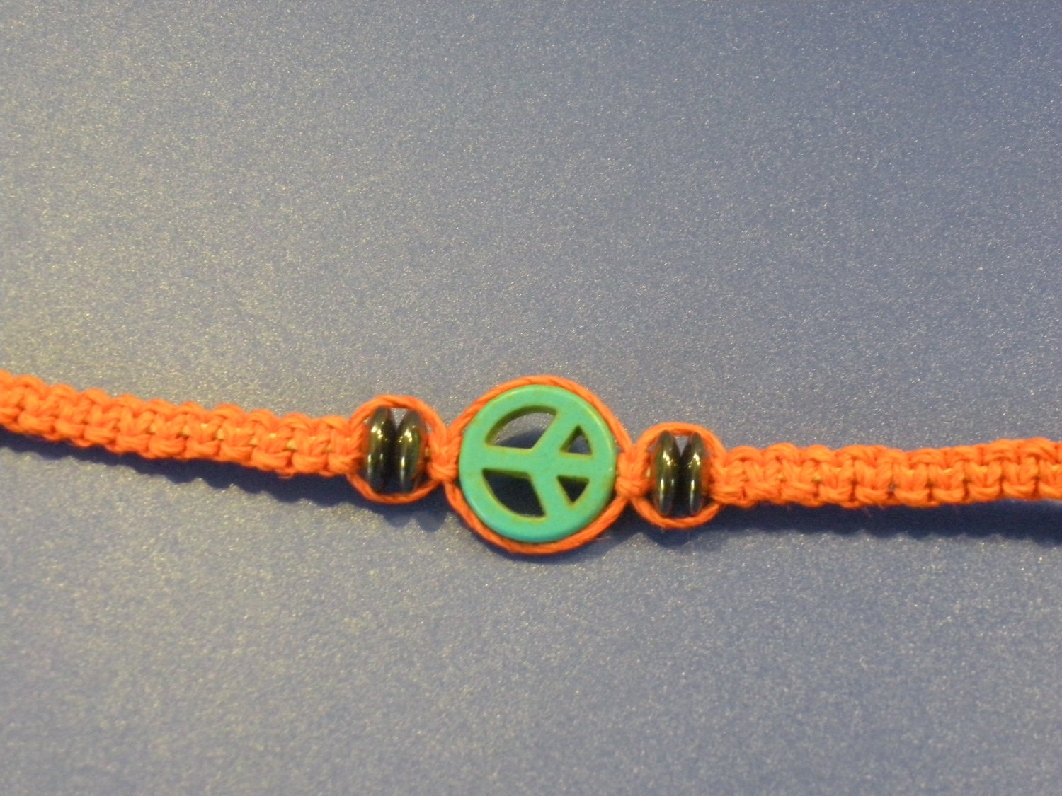 Orange and Blue Peace Sign Hemp Bracelet with Hematite Beads