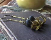Black Annis. Rustic Brass element and black silk bead with fleur de lis connectors- earrings
