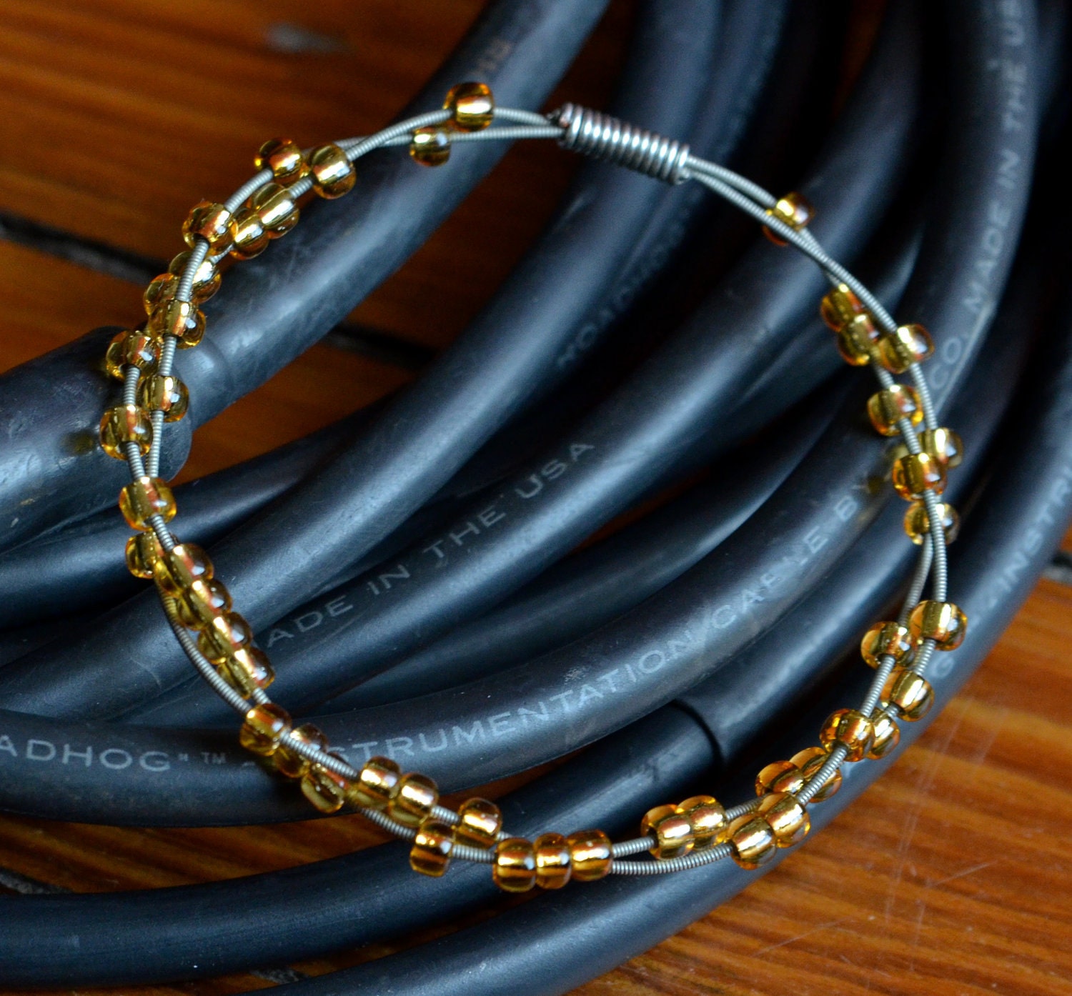 Recycled Guitar String Bangle with Amber Glass Beads
