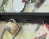 28" black wooden shelf for knik knack, plates  pegs made USA
