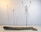 Wire Sculpture - Titled "Celebrate Life". Mixed Media Sculpture mounted on Driftwood from the Atlantic. One of a kind.