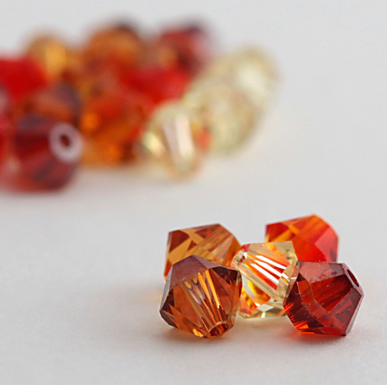 Swarovski Crystal Elements - 20,  4 mm bicone crystals - Sunrise Orange Mix
