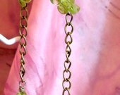 Green dangle earrings.
