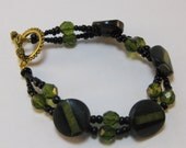 Vintage green, black button bracelet w/ green, black glass beads, gold tone closure