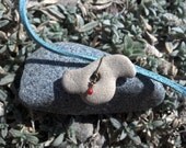 Bird Rock Necklace. Mediterranean Beach Stone with a Hole on Faux Suede in soft blue OOAk