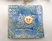 Ceramic Moon Plate impressed with PEACE and lace underside