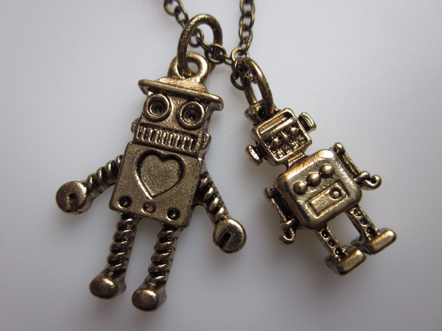 ROBOT FRIENDS Necklace. Pair of Robots in Antique Gold Finish.