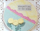 6 inch name and birthdate hoop art in pink, yellow and green. perfect for a girls' nursery or bedroom.