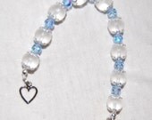 Icicle- let the frost melt a little with this adorable frosted glass bracelet with ice blue crystal accents. charming and elegant while sim