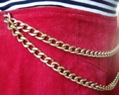 Red Hot suede shorts with chains