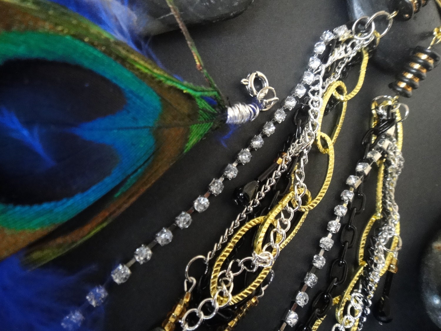 ON SALE Peacock feather earrings with black, gold, silver and rhinestone chain