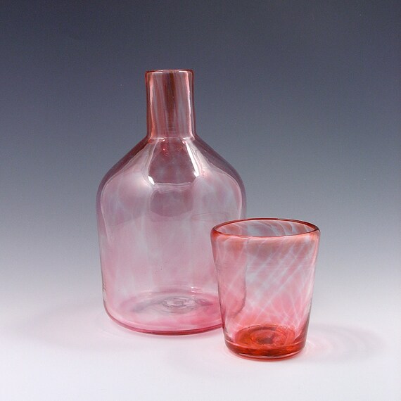 bottle with cup on top