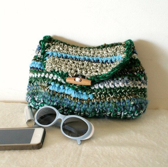 Green crochet clutch with recycled fabric scraps and wooden button