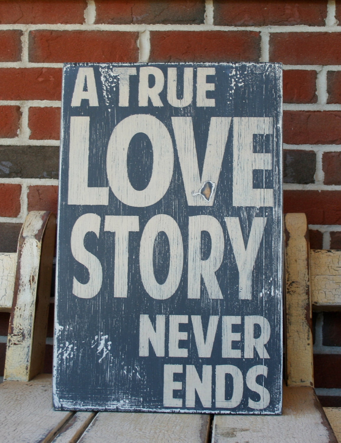 A True Love Story Never Ends Heavily Distressed Sign in Black Vintage Style