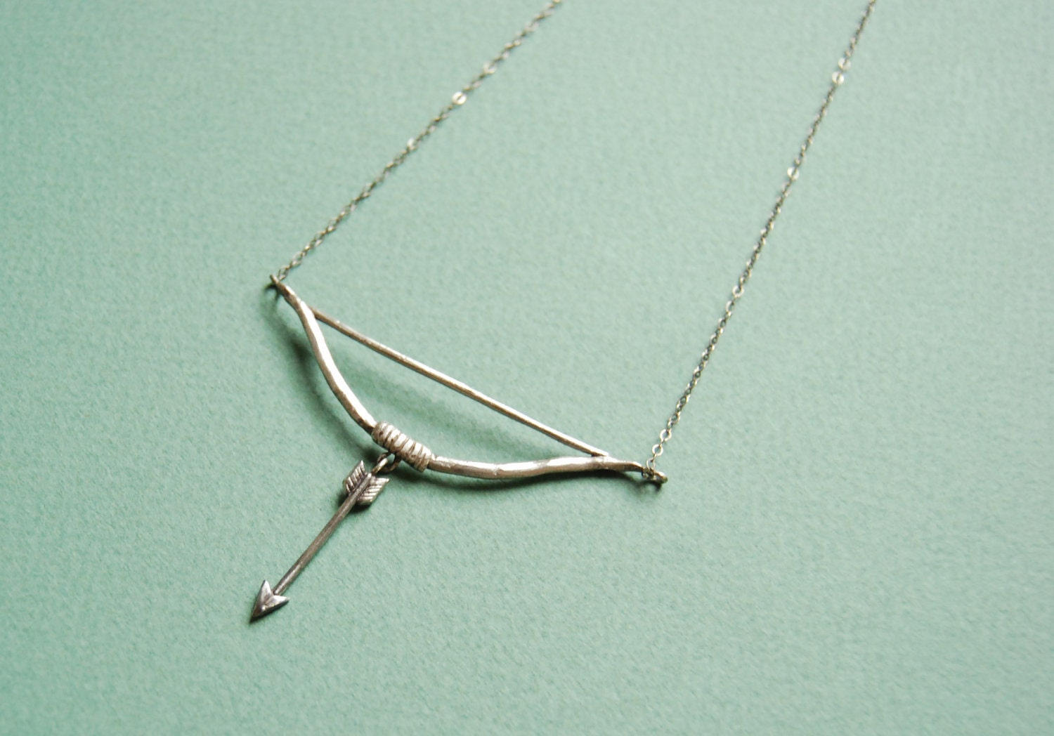 Silver bow and arrow necklace