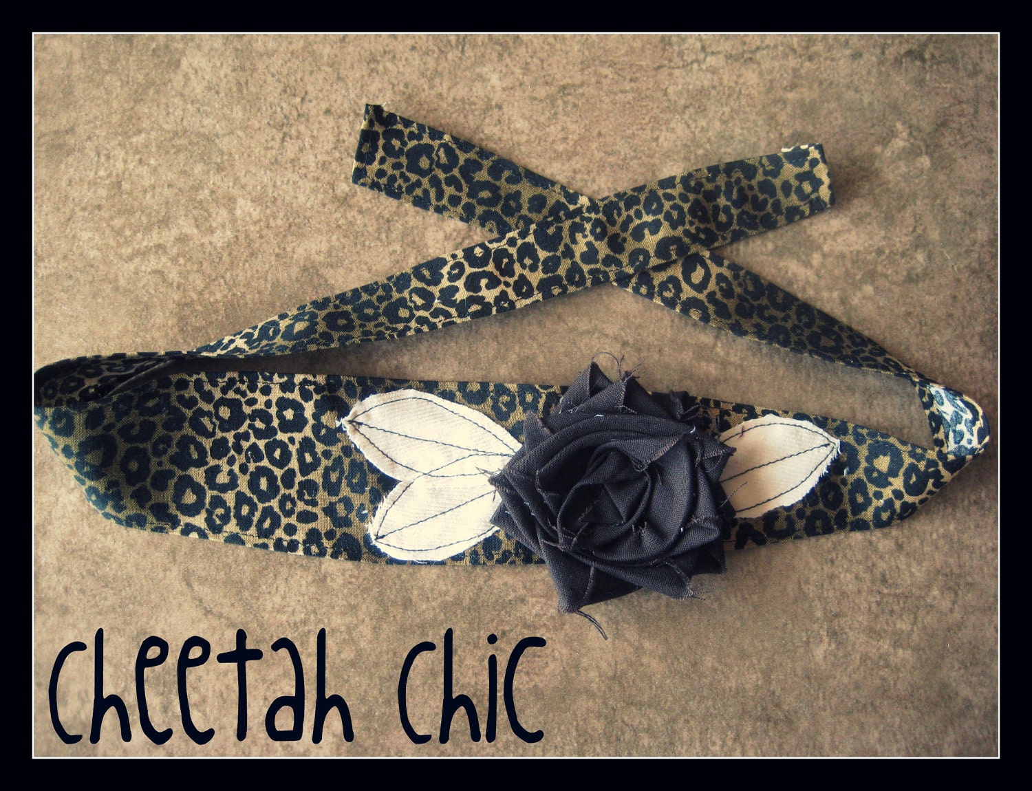 Shabby chic cheetah print headband with a chocolate brown flower and cream leafs
