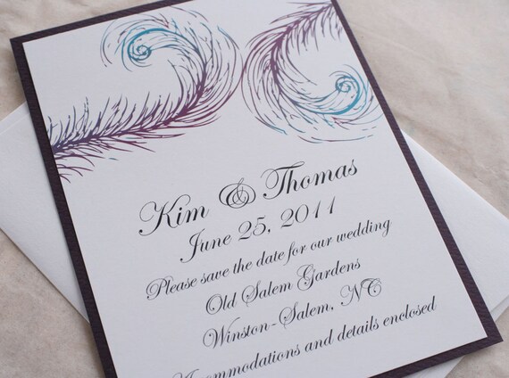 Save the date card with feather motif in purples and blues