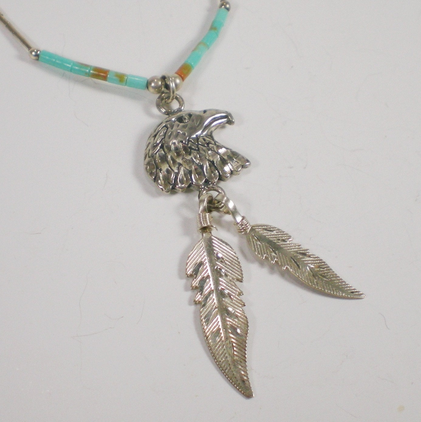 Vintage Sterling Eagle Feathers And Turquoise Pendant by paleorama from etsy.com