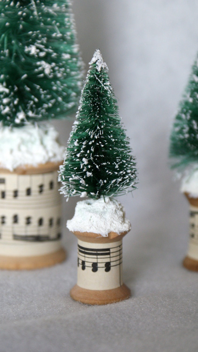Set of 3 snow covered bottle brush trees with a vintage spool base