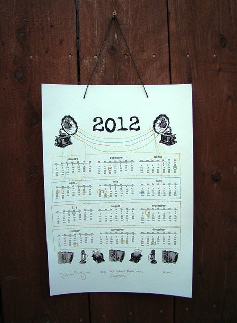 2012 Hand Printed and Sewn Calendar - black screen print with orange, yellow, blue and green stitching